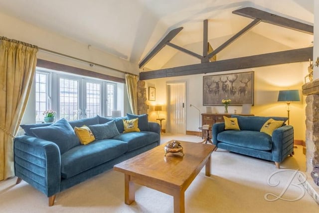 The first stop on our tour of the Kirkby Hardwick barn conversion is this lovely, large lounge, complete with high ceilings and ceiling beams. A set of French doors leads outside to the garden.