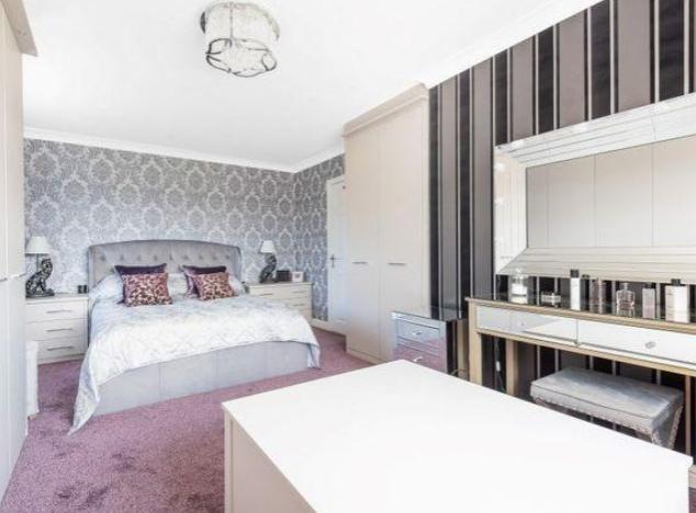 This bedroom is also spacious, bright and fits in perfectly with the modern styling of the house.