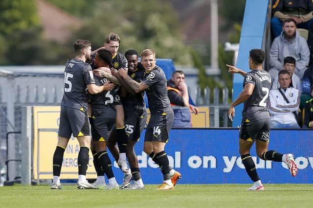 The visitors celebrate going ahead against Stags during the Sky Bet League 2 match against Stockport County FC at the One Call Stadium, 26 August 2023.  
Photo credit should read : Chris & Jeanette Holloway / The Bigger Picture.media
