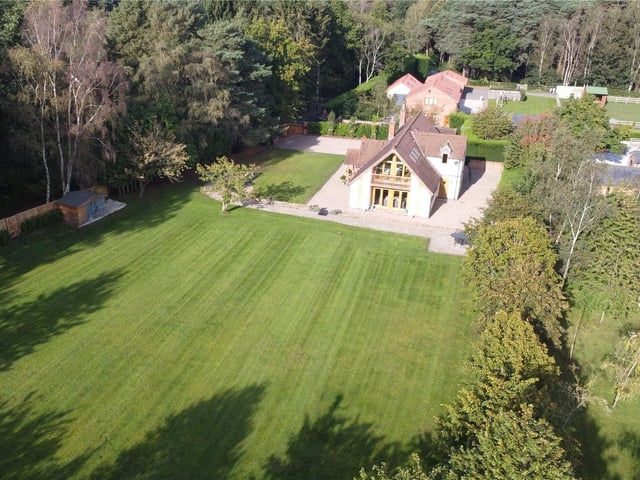 Let's step outside now to take a closer look at the exterior of the property. This bird's eye view shows how the house nestles in a most attractive location.