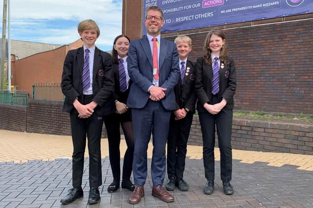 Sutton Community Academy principal Patrick Butterell with Year 8 pupils.