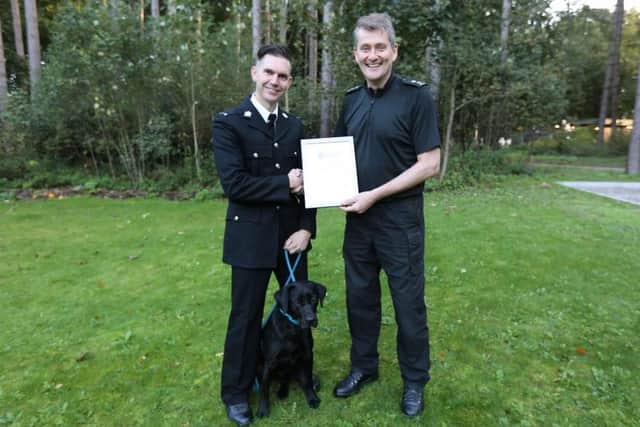 Nottinghamshire's new PD Oakley, with handler PC James Sills and Inspector Tim Ringer.
