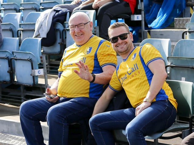Mansfield Town fans watch the 1-1 draw at Gillingham.