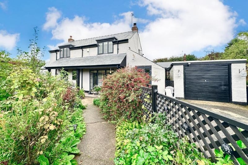The last photo of our gallery shows that the £340,000 Rose Cottage also boasts a garage.