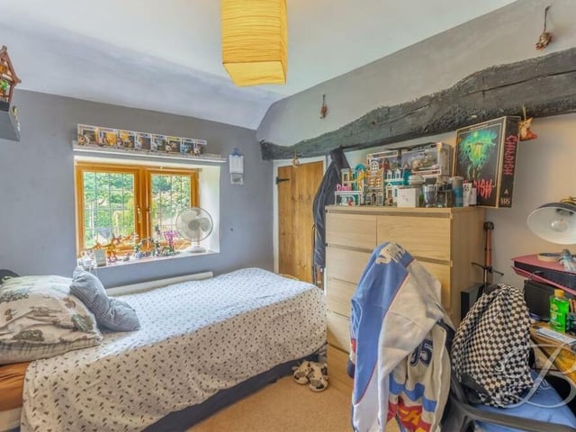 Rustic, traditional features that are so evident throughout the Warsop property can be found here too in this second bedroom.