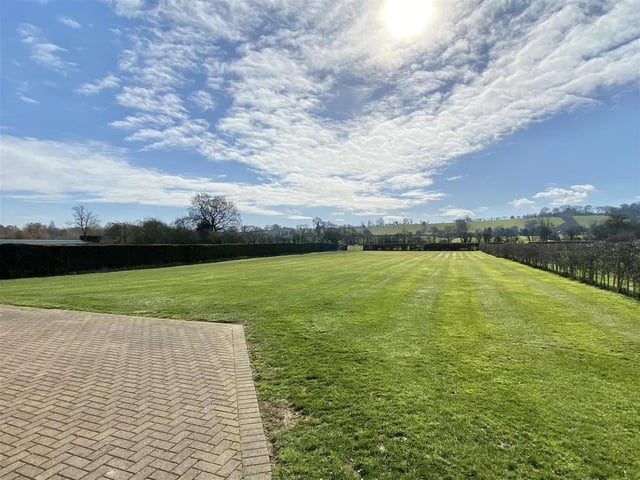 Immaculately presented, a contemporary detached family home offering accommodation extending to over 6,200 sq ft with gardens and paddock which in total offer 5.1 acres. To the rear there is a lawned garden with a private block paved courtyard garden, field gate access to fenced paddocks (totalling 4.5 acres (sts)) and stable block with power and water connected.