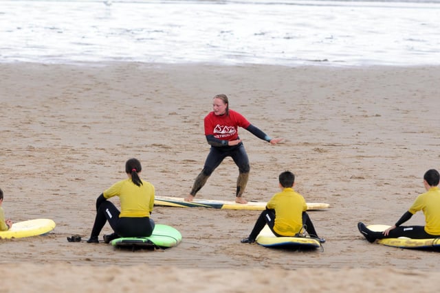 Socially distant surfing lessons got under way as this instructor teaches the students sat on their boards by the coast.