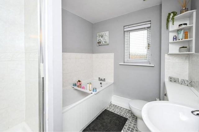 Let;s round off our look at the first floor with the family bathroom, which has a separate bath and shower.