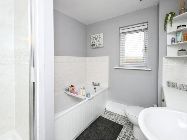 Let;s round off our look at the first floor with the family bathroom, which has a separate bath and shower.