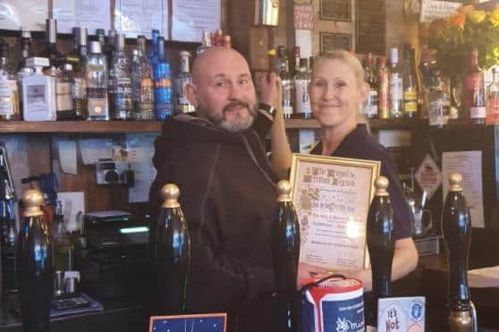 Dog and Parrot owners David and Kathryn Boam were presented with a canon bell by the Royal British Legion.
