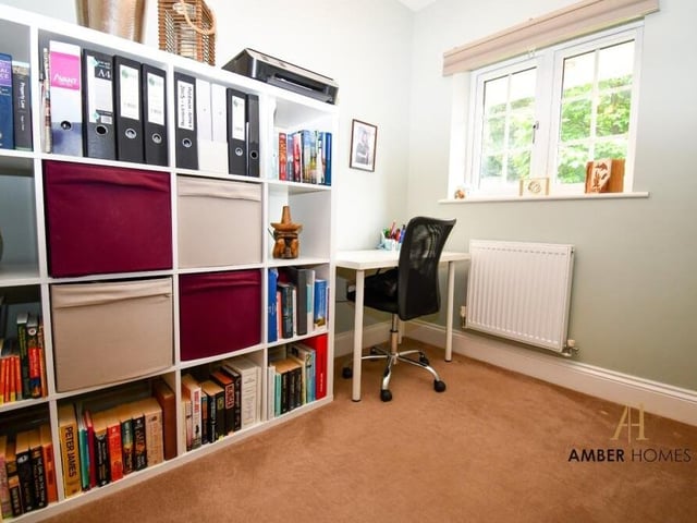 This versatile room on the ground floor is currently being used as a home office. But it could easily be converted into a playroom or a guest suite.
