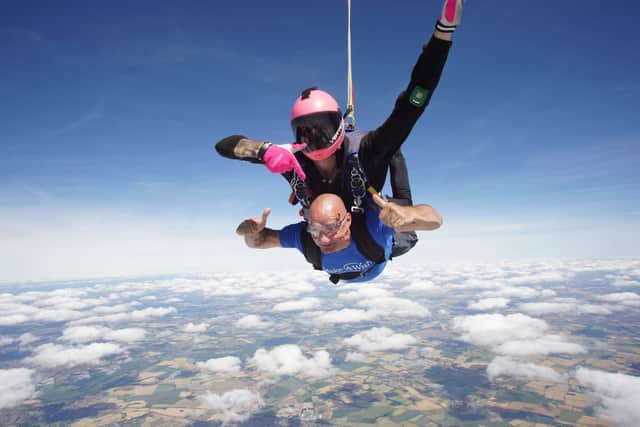 Carl Slaney giving the thumbs up as he took part in the skydive at Langar Airfield near Nottingham.