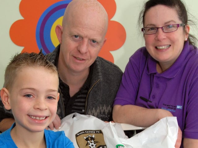 Over 800 selection boxes have been donated to sick youngsters across the area from readers of the Ashfield Chad and staff and supporters at Notts County Football Club . Pictured is event organiser Rob Bristol, centre, presenting boxes to Kings Mill Hospital's Ward 25 Play Specialist Julia Smith, right and Sam McCluskey in 2010.