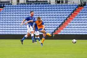 Rhys Oates opens the scoring for Mansfield Town at Oldham Athletic.