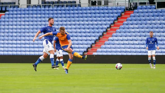 Rhys Oates opens the scoring for Mansfield Town at Oldham Athletic.