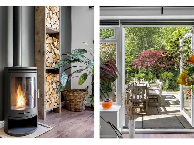 The cosy lounge diner has laminate flooring, coving to the ceiling, a radiator, and a striking cylindrical bioethanol stove in charcoal grey with an angled flue pipe and decorative log storage feature.