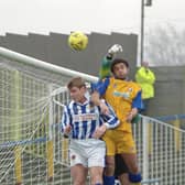 Isyeden Christie challenges for the ball against Chester.