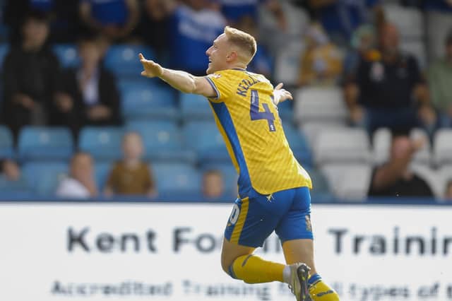Davis Keillor-Dunn celebrates his controversial goal at Gillingham in Saturday's 1-1 draw. Photo by Chris & Jeanette Holloway/The Bigger Picture.media.