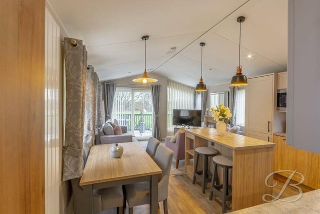 Here is the dining area within the open-plan kitchen. Ideal for family meals or for entertaining friends.