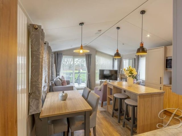 Here is the dining area within the open-plan kitchen. Ideal for family meals or for entertaining friends.