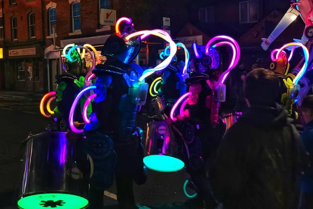 Amazing neon Lights against the night from the drum troupe