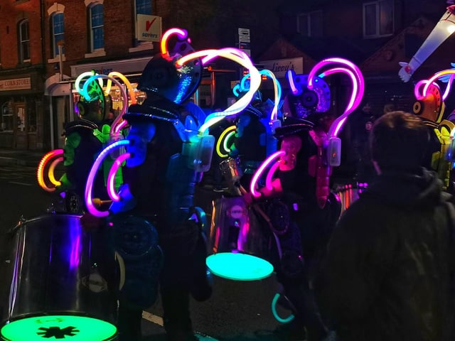 Amazing neon Lights against the night from the drum troupe