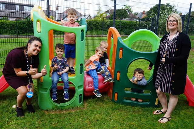 Lisa Lounds, nursery manager right, and assistant manager Nicola Channer celebrate Rocking Horse Nursery;s good Ofsted report with children.