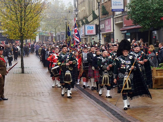A pipe band leads the parade through Mansfield town centre