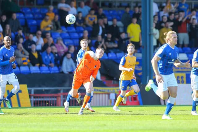 Goalkeeper Nathan Bishop gets Mansfield on the move at Oldham this afternoon. Photo by Chris Holloway/The Bigger Picture.media