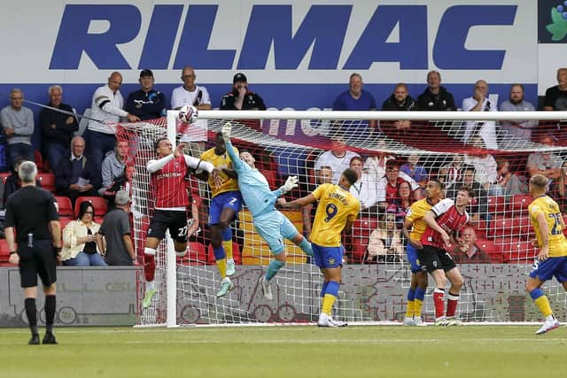 Mansfield Town goalkeeper Christy Pym (01) punches clear during the Sky Bet League 1 match against Lincoln City FC, LNER Stadium, 24 August 2024 Photo credit Chris & Jeanette Holloway / The Bigger Picture.media