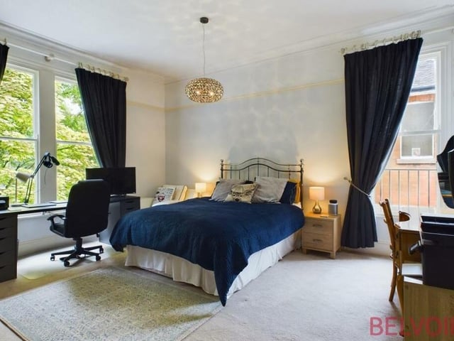 The second bedroom at the £795,000 Mansfield wardrobe is a fantastic size and boasts a custom-made triple wardrobe. There are also sash windows to the front and side, a picture rail, cast-iron radiator and room for desks or dressing tables.