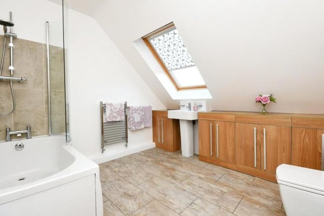 Sandwiched between two of the bedrooms on the first floor is this attractive and contemporary family bathroom