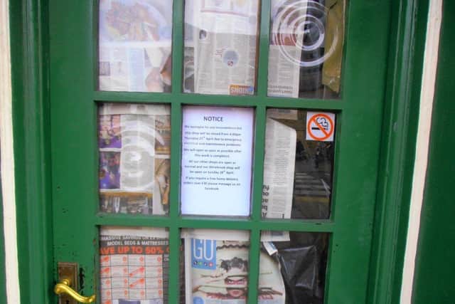 The misleading sign placed in the window