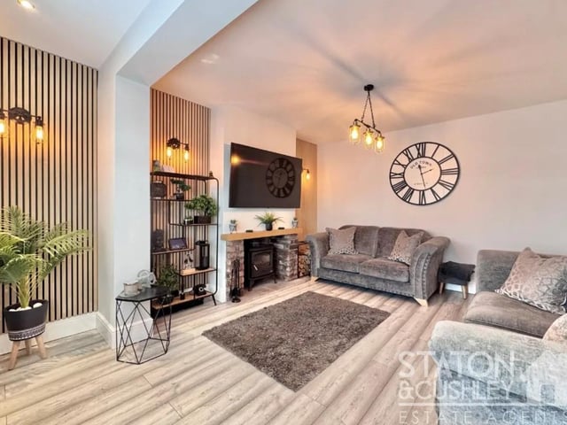 The ground floor boasts a spacious living room with a beautifully featured multi fuel log burner and window to the front elevation creating a cosy space for relaxation.