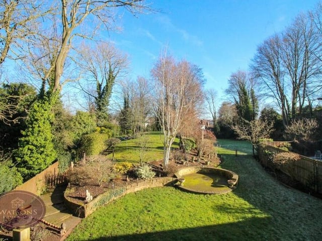 The idyllic view of the extensive back garden from the balcony of the second bedroom.