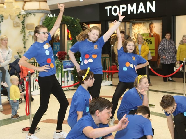 The dancers from Queen Elizabeth School school drop into the Four Seasons Shopping Centre to perform as part of their Dance Dash fundraiser for Children in Need