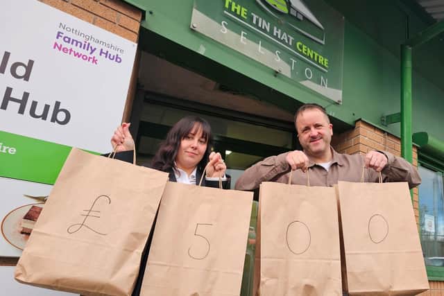 Danni Allen, a funeral director at Gillotts Funeral Directors, with Chris Tomlinson, manager of the Tin Hat Centre Food Bank in Selston, which has received £500 from the firm’s Christmas appeal.