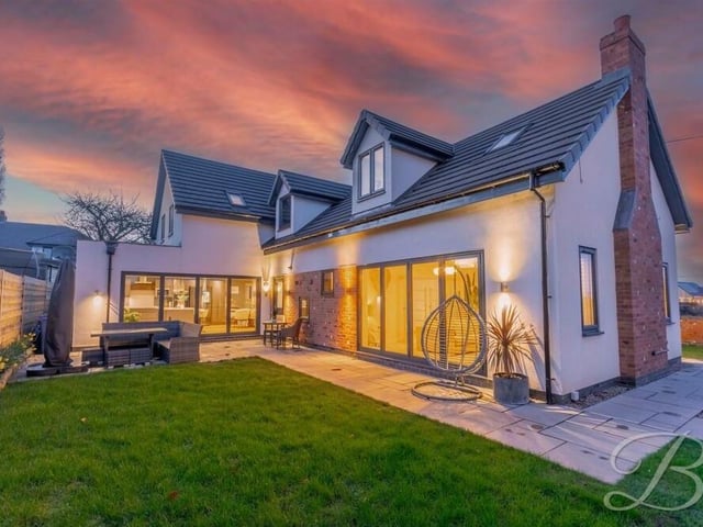 The sets of bi-folding doors on the ground floor of the £650,000 Pleasley Vale property lead out to the back, where there is a small lawn and patio area, with space for seating.