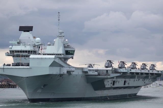 HMS Queen Elizabeth leaves Portsmouth Naval Base as it sets sail for flight trials. Picture: Andrew Matthews/PA Wire