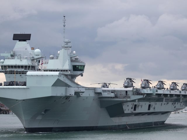 HMS Queen Elizabeth leaves Portsmouth Naval Base as it sets sail for flight trials. Picture: Andrew Matthews/PA Wire
