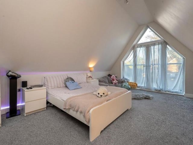 No doubt about the main highlight of the third bedroom -- a full-height feature window with doors opening on to a Juliet balcony.