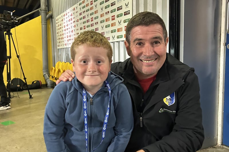 Kirkby youngster Sky Thirkill (7) enjoys a picture with Nigel Clough after watching his first Mansfield Town game.