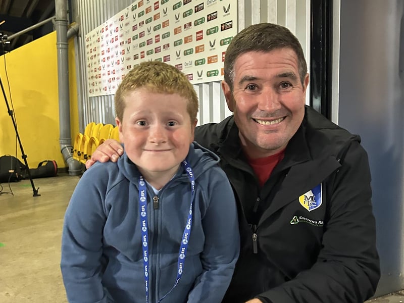 Kirkby youngster Sky Thirkill (7) enjoys a picture with Nigel Clough after watching his first Mansfield Town game.