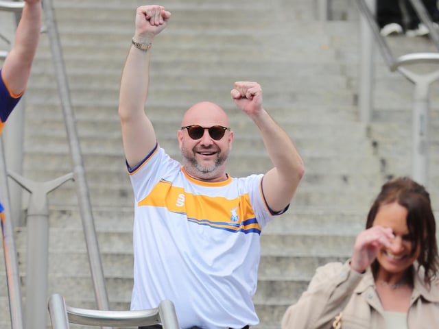 Mansfield Town fans watch the drama unfold inside Wembley.
