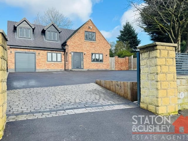 There is a superb sized driveway and garage with remote access door to the front providing ample off street parking as well as pretty outdoor lighting.