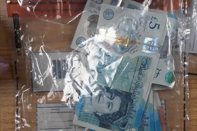 Two bundles of wraps and cash were recovered