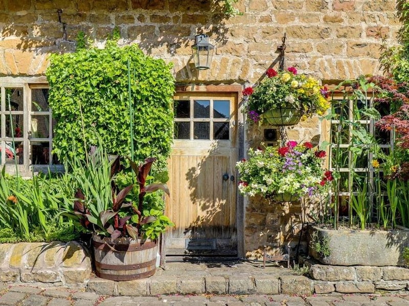 The front of the £500,000 cottage is adorned with a variety of established plants and shrubs, plus courtesy lighting, ensuring a warm welcome.