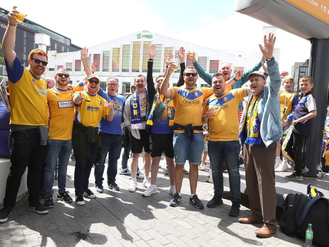 Mansfield Town fans soak up the Wembley atmosphere.