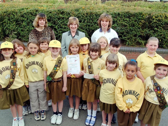 Kirkby Brownies presenting a cheque to the Lincs and Notts Air Ambulance in 2001