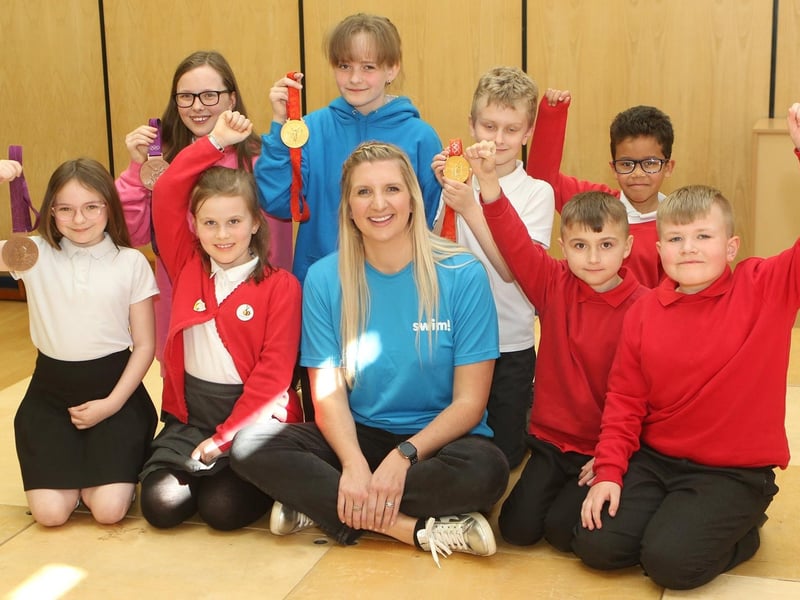 Rebecca Adlington and her Olympic medals with children from all the KS2 classes at Crescent Primary School.